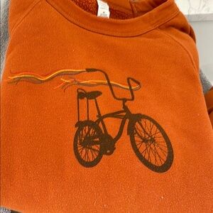 Rust Orange Bicycle Print Men's Sweater from “Mate” in Provincetown